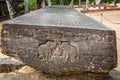 Large ancient stone carved with elephants and sanskrit writing in Polonnaruwa, Sir Lanka