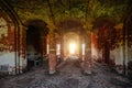 Large ancient vaulted hall with columns at abandoned building