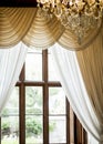 A large antique window in a wooden frame