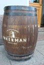 Large antique wooden barrel with wine or beer isolated