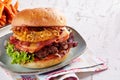 Large appetizing Hawaiian burger with bacon Royalty Free Stock Photo