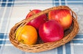 Large apples in a wattled basket.