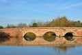 Large arched redbrick river bridge Royalty Free Stock Photo