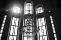 Large arched windows with a chandelier, The concept of seeing light and the power of prayer when the light comes through Royalty Free Stock Photo