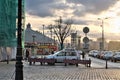 Riga, Latvia, November 2019. Dawn over the square at the bridge over the river.