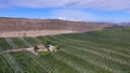 Aerial View of Rich Farmland in the Okanogan Valley below Satellite Dish Filled Hilltop
