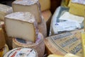 Large assortment of different cheeses for sale at cheeses store of farmers market