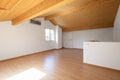 Large attic with wooden floors and exposed beams