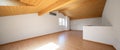 Large attic with wooden floors and exposed beams