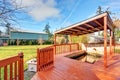 Large back yard with grass, covered deck and grass. Royalty Free Stock Photo