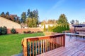 Large back yard with lots of grass and deck. Royalty Free Stock Photo