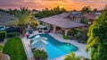 Large backyard with pool, spa, built-in BBQ, and fire pit AIG535 Royalty Free Stock Photo