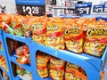 Large bags of Cheetos Flamin` Hot Crunchy chips at store