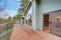 Large balcony with fenced garden view