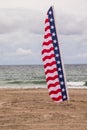 American flag banner on beach near ocean