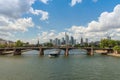 Large barge moving upstream in front of the skyline, Frankfurt, Germany