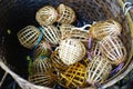 Large basket filled with tiny woven bamboo bird cages in Luang Prabang, Laos