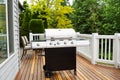 Large BBQ Grill on Wooden Deck Royalty Free Stock Photo