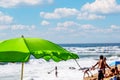 Large beach parasol in the beach with a calm view to the Atlantic ocean. Royalty Free Stock Photo