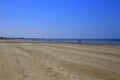 The large beach of Qurum, with unrecognizable walking people, Muscat, Oman