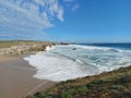 Large beach, sandy cove in the middle of the cliffs of Brittany