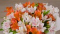 Large beautiful bouquet of orange and white alstroemeria flowers: close up Royalty Free Stock Photo