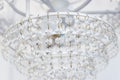 Large beautiful glass chandelier hanging on the ceiling Royalty Free Stock Photo