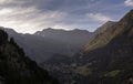 large and beautiful mountains with green forests in the sunlight under a blue sky Royalty Free Stock Photo