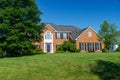 Large, beautiful, single-family brick country house. Large lawn and green trees