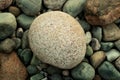 Large beautiful white colored stone and many small stones Royalty Free Stock Photo