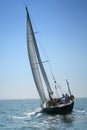 The large, beautiful yacht in the light-blue sea.