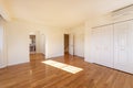 Large bedroom with built-in wardrobes, walk-in closet leading to an en-suite bathroom in a two-story detached house Royalty Free Stock Photo