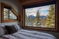 large bedroom window in a cabin offering snow-capped views