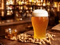 Large beer on a bar desk with peanuts