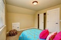 Large beige girl bedroom interior with pink bed