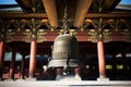 a large bell in a buddhist temple