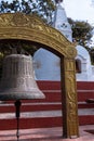 A large bell and small stupa at Bajradhatu Chaitya, at the entrance of Swayambhunath Stupa