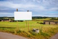 Large billboard sign on a green field Royalty Free Stock Photo