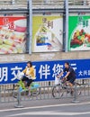 Large billboards near cycle lane in city center, Beijing, China