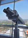 Large binoculars can be used for viewing views on tall buildings Royalty Free Stock Photo