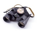 Large binoculars and compass on a white background Royalty Free Stock Photo