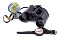 Large binoculars, globe and compass on a white background Royalty Free Stock Photo