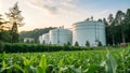 Large biofuel storage tanks surrounded by lush greenery and crops Royalty Free Stock Photo