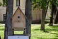 Large birdhouse from wooden planks for birds in the park Royalty Free Stock Photo