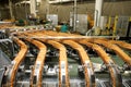 Large biscuit factory. A line of biscuits in a large factory. Packing crackers on the machine. Innovative production Royalty Free Stock Photo