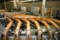 Large biscuit factory. A line of biscuits in a large factory. Packing crackers on the machine. Innovative production Royalty Free Stock Photo