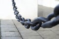 Black thick steel chain. Chain for fencing. Close-up. Background Royalty Free Stock Photo