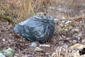 Garbage bag left in the forest Royalty Free Stock Photo