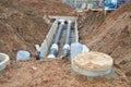 Large Black Metal And Plastic Water Pipes For Hot And Cold Water At A Construction Site During A Repair In A New Neighborhood