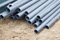 Large black plastic sewer plumbing pipes for the construction of water pipes or sewers at a construction site during the repair Royalty Free Stock Photo